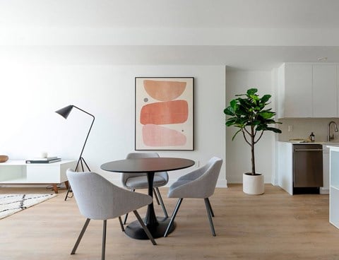 Modern dining area with round table at 929 Richmond Apartments, Ontario