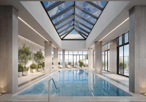 A large indoor swimming pool with a skylight above it at Petries Landing I Apartments , Ottawa, ON