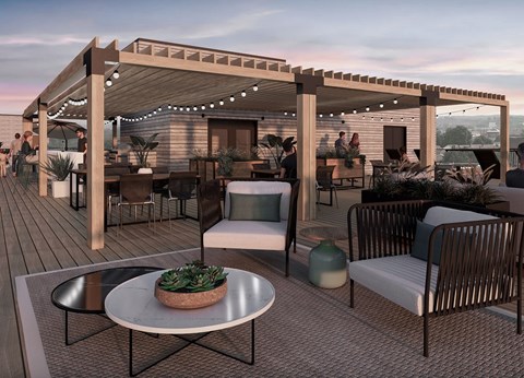 A patio with a table and chairs under a pergola.
