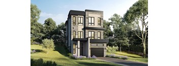 A modern house with a grey exterior and a black garage door.