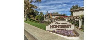A sign that says "Casa Monterey" in front of a building.
