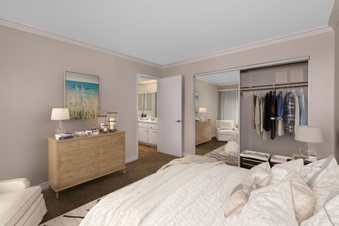 A bedroom with a large bed and a wardrobe.