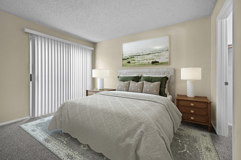 A bedroom with a large bed and a painting above it.