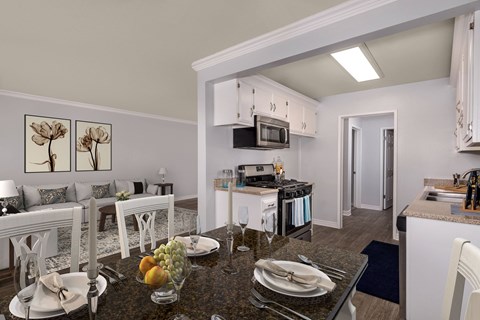 A modern kitchen with a breakfast table set.