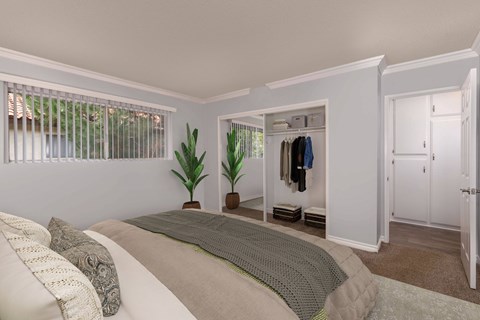 A bedroom with a bed, pillows, a window, a coat rack, and a plant.