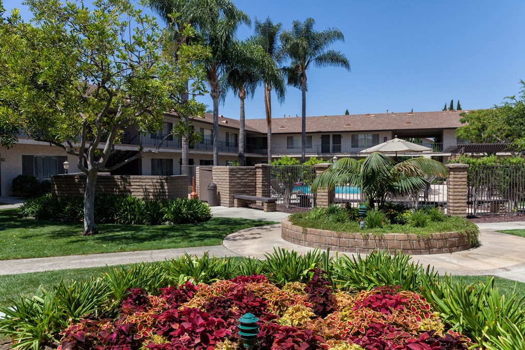 A building with a green lawn in front of it.