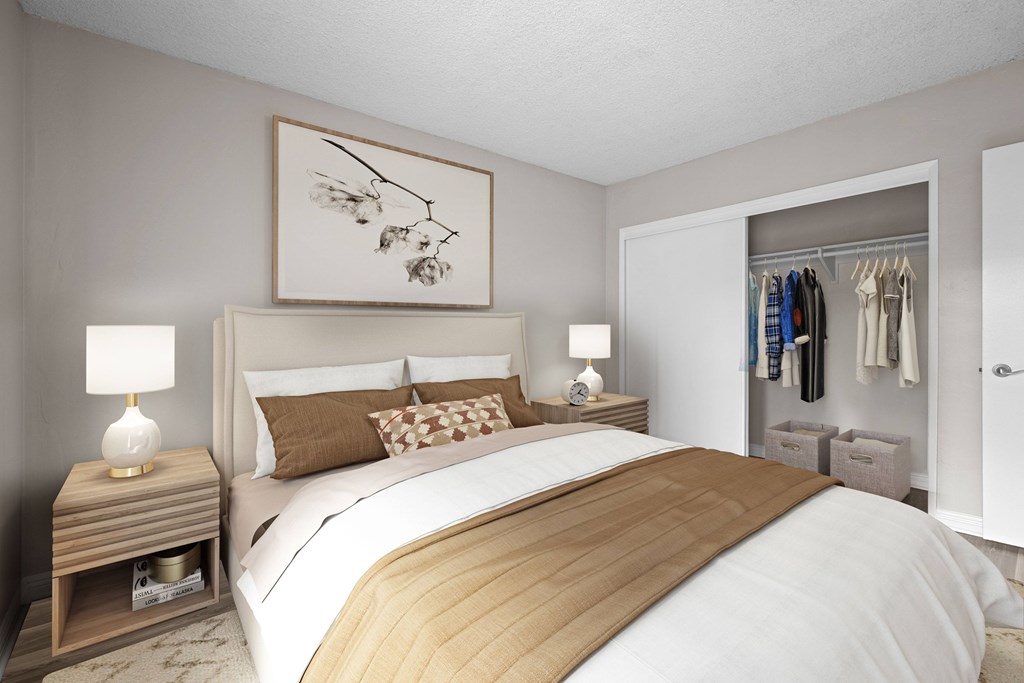 A bedroom with a large bed and a wooden headboard.