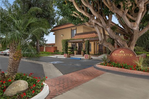 The entrance to a residential complex named Los Arbolitos.