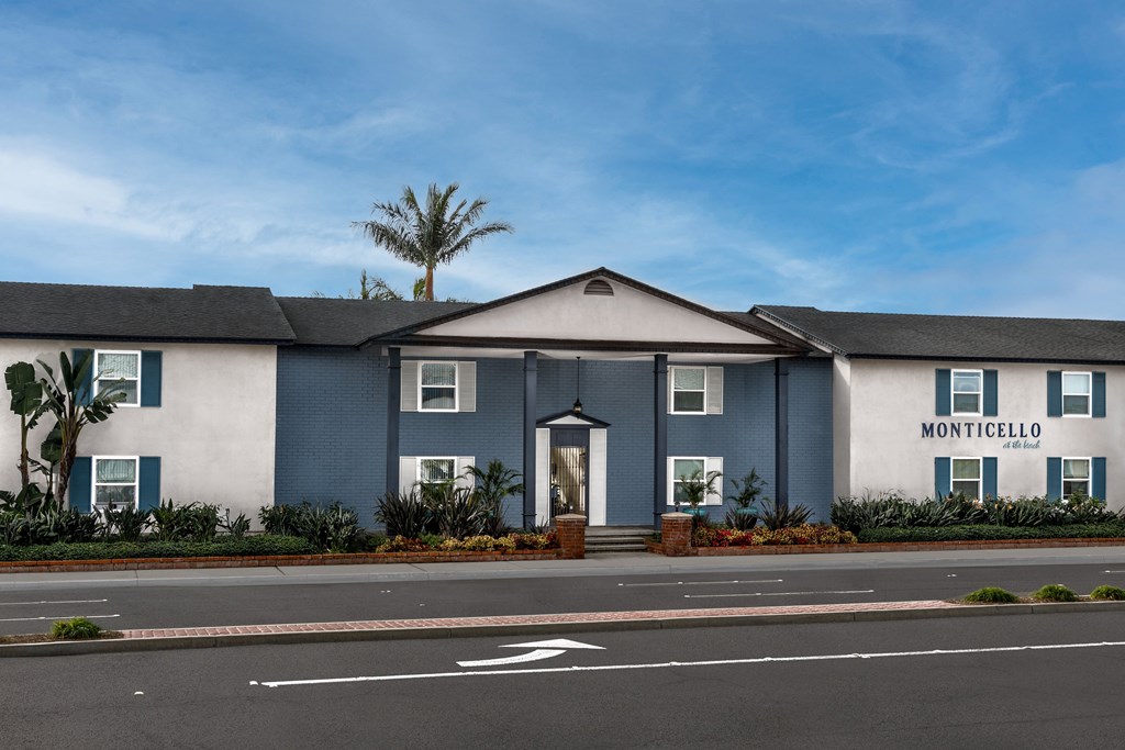 The Monticello building has a white and blue facade.