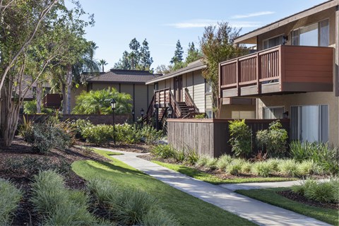 A row of houses with a pathway in between.