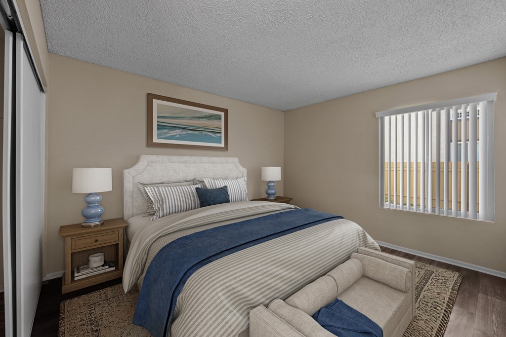 A bedroom with a large bed and a painting on the wall.