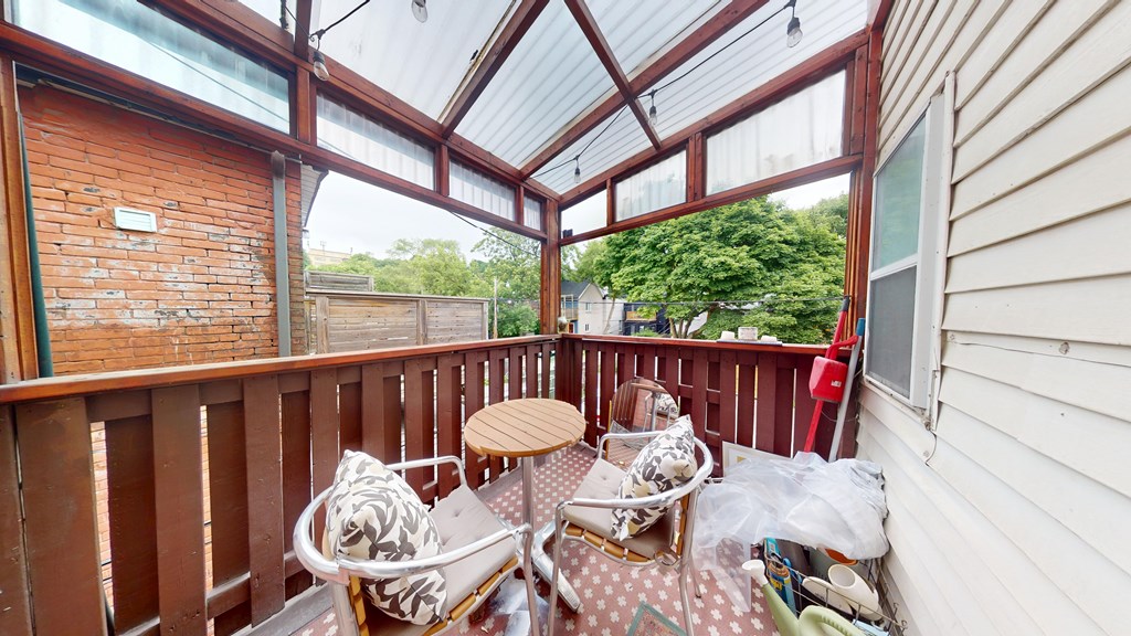 A patio with a table and chairs is shown.