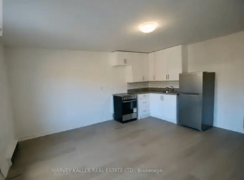 A kitchen with white cabinets and stainless steel appliances.