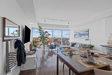 A modern dining room with a view of the city.