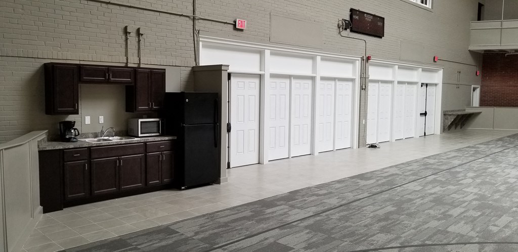 an empty kitchen and living room in a building