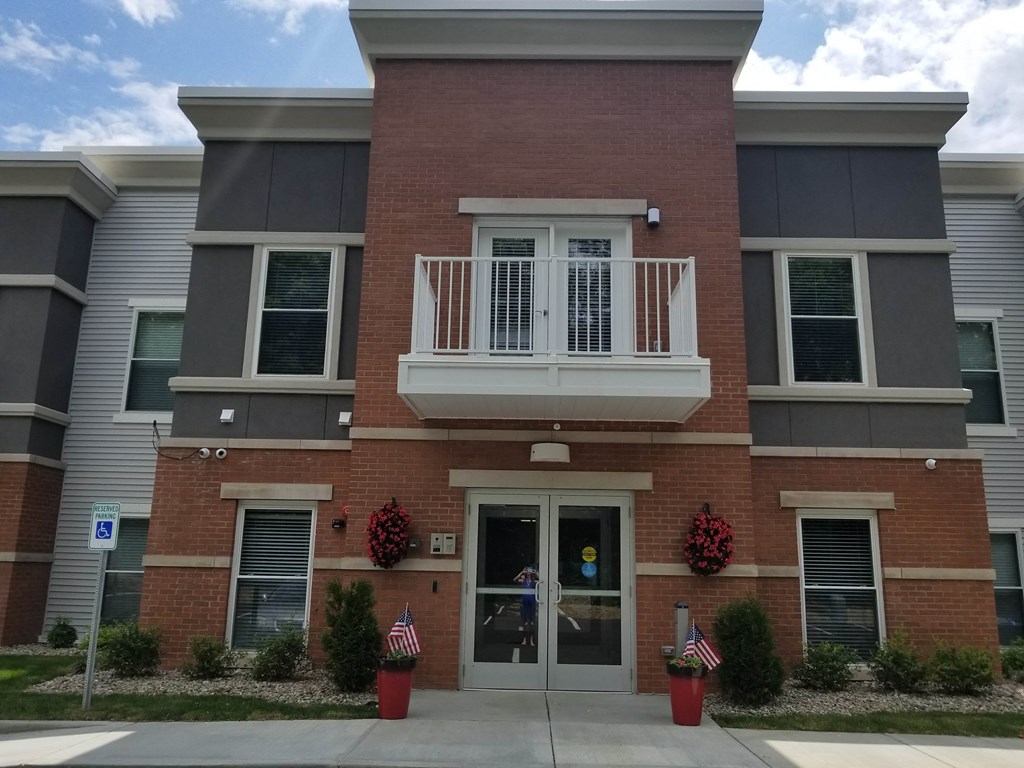 a large brick building with a balcony on top of it