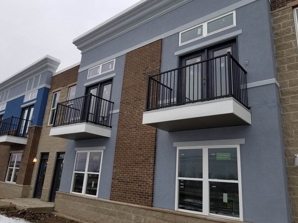 a building with two balconies on the side of it