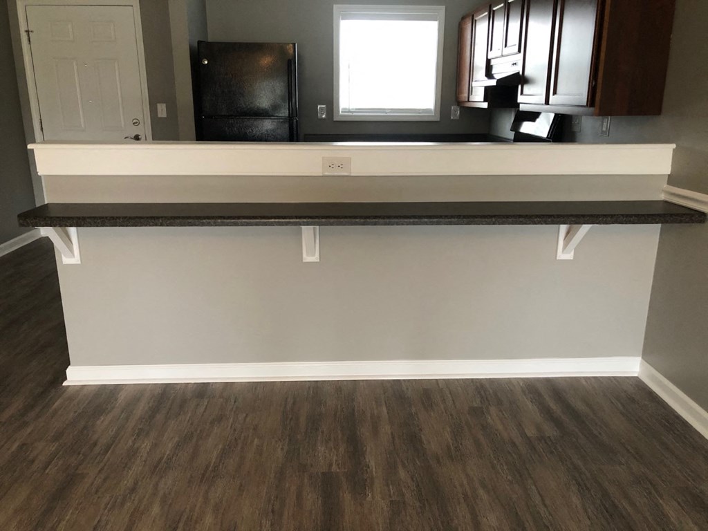 a view of a kitchen with a counter top and a window