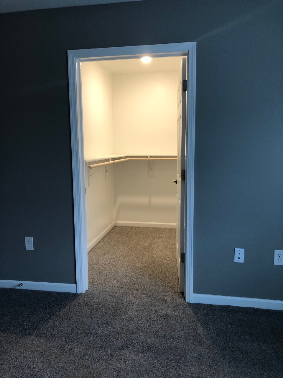 a room with a closet and an open door