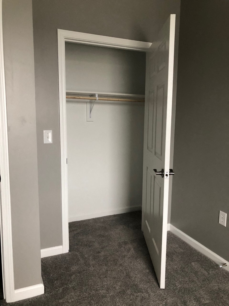 a room with a closet and a door to a closet