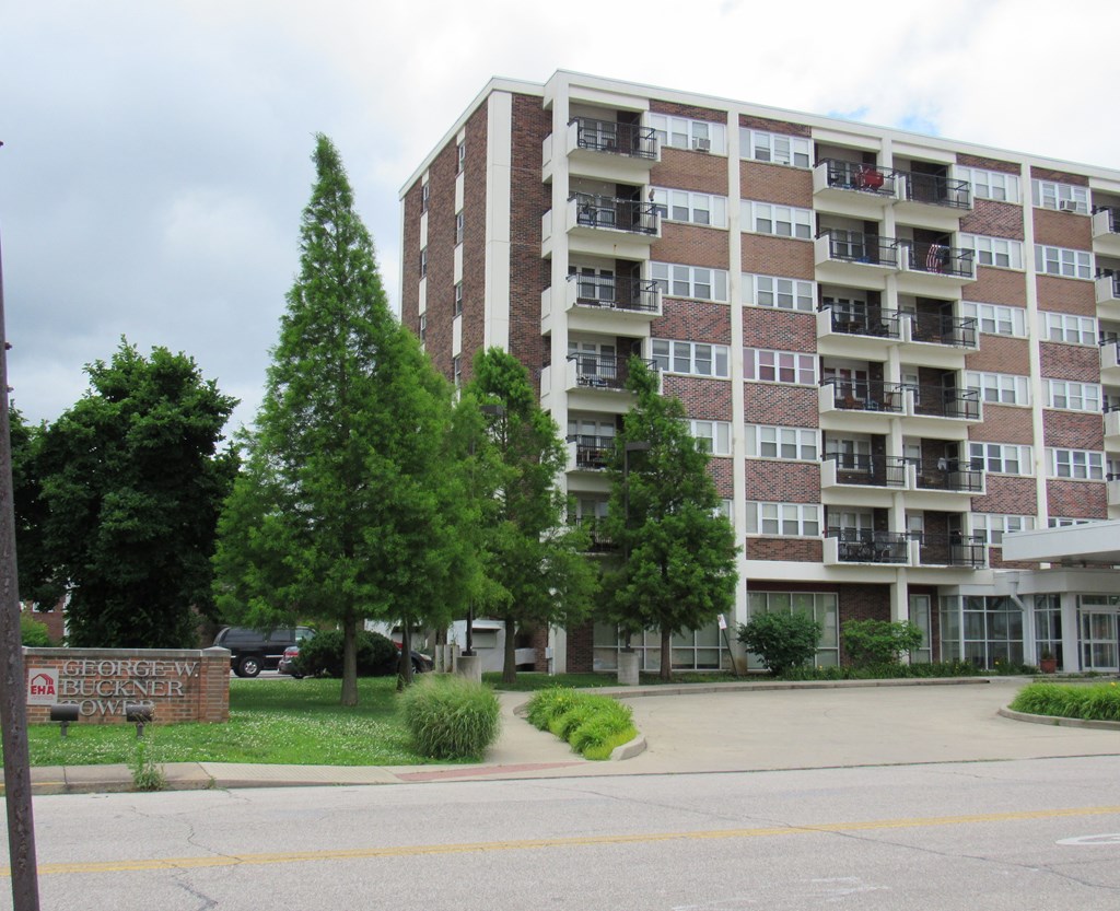an apartment building on the corner of a street