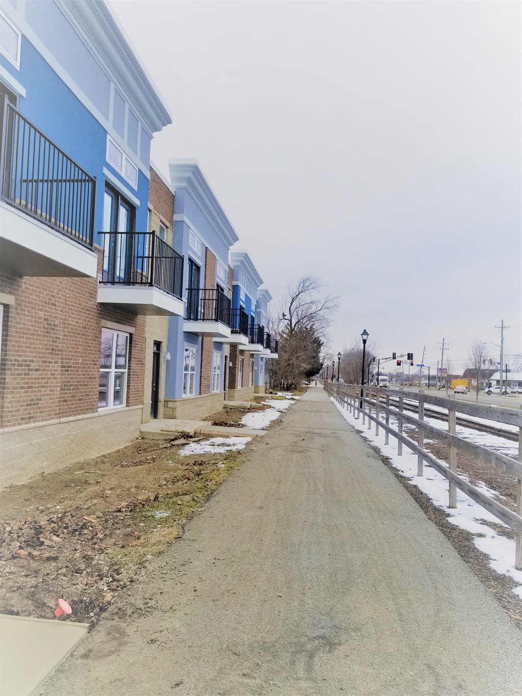 a row of houses on the side of a road