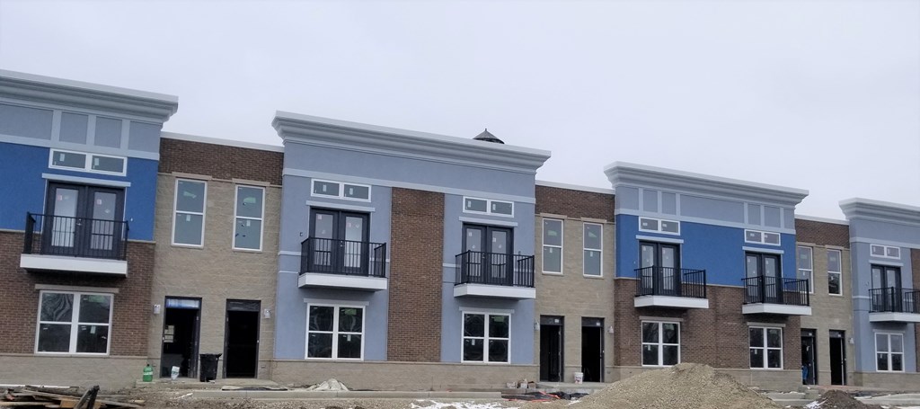 a row of new town houses under construction