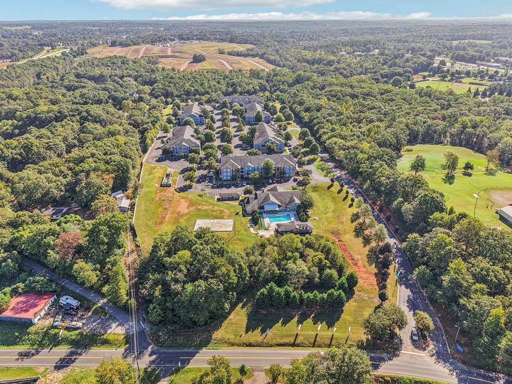 A bird's eye view of a residential area with houses and trees.