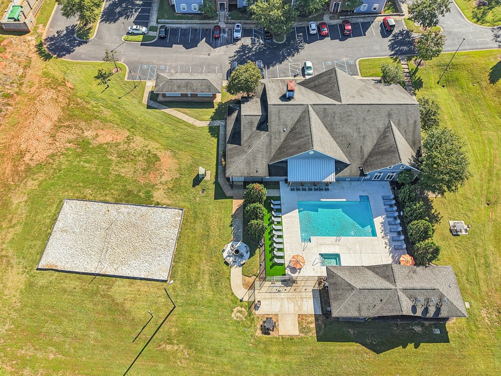 A large house with a pool and a trampoline.