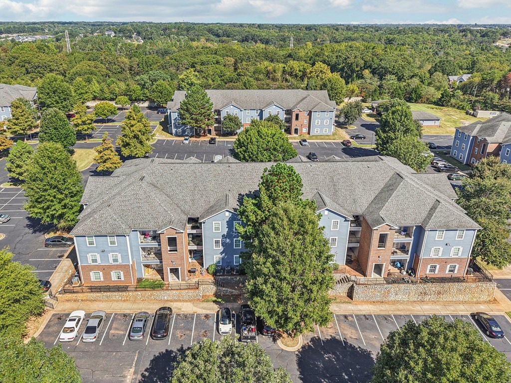 A large building with a parking lot in front of it.