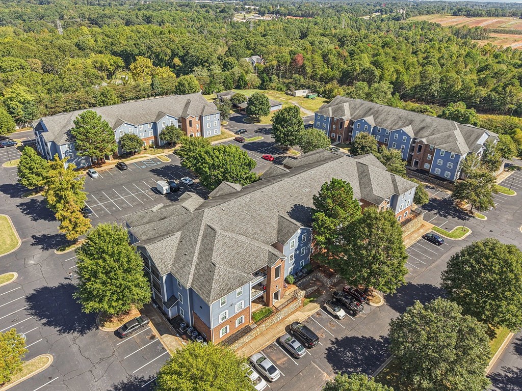 A parking lot with a building in the background.