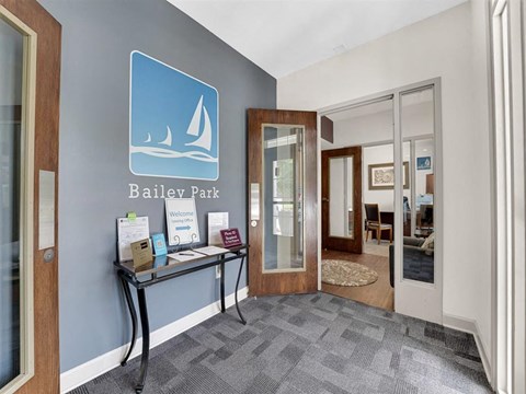 A reception area with a blue sign that says Bailey Park.