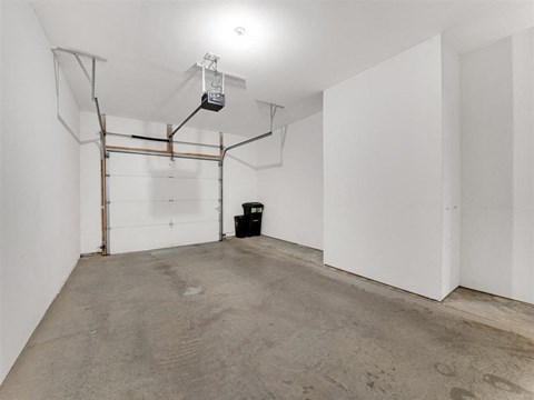 A room with a white wall and a white door.