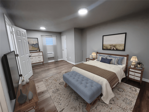 A bedroom with a large bed, a television, and a painting on the wall.