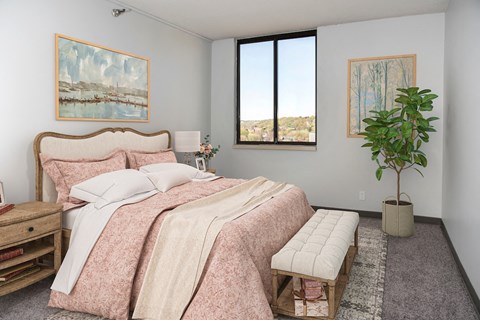 a bedroom with a bed and a window