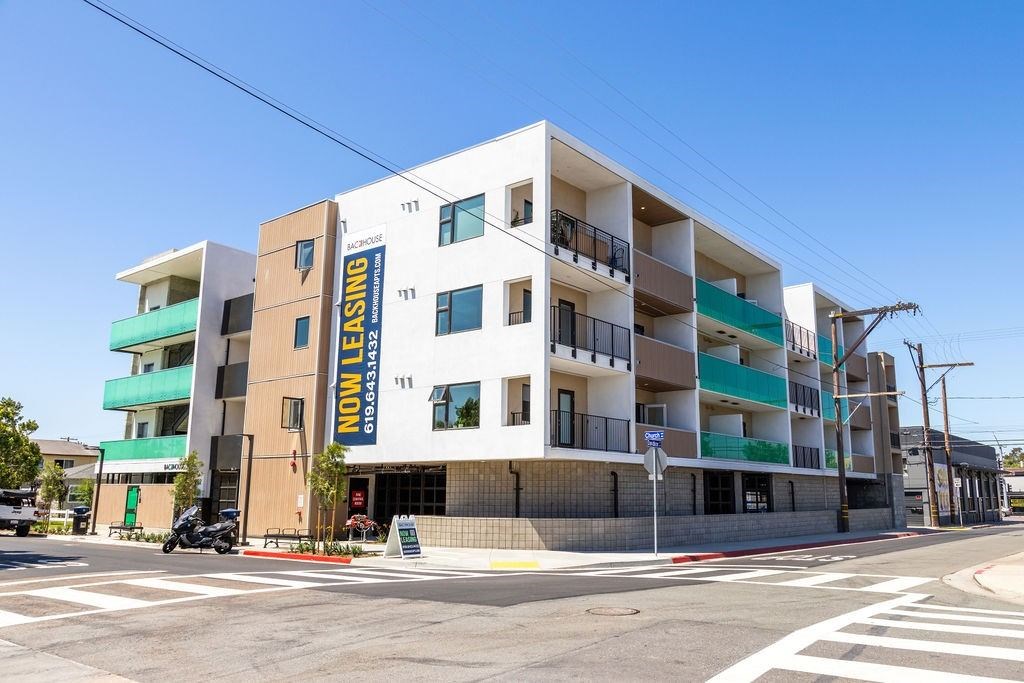 A multi-story building with the words "Non-Leasing" on the side.