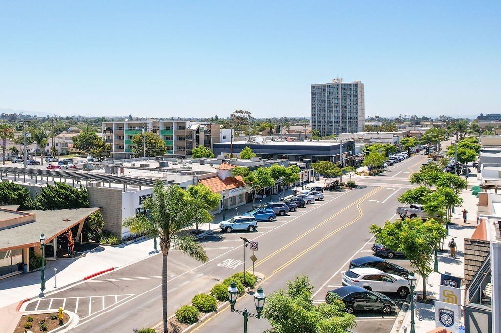 A city street with cars and buildings.