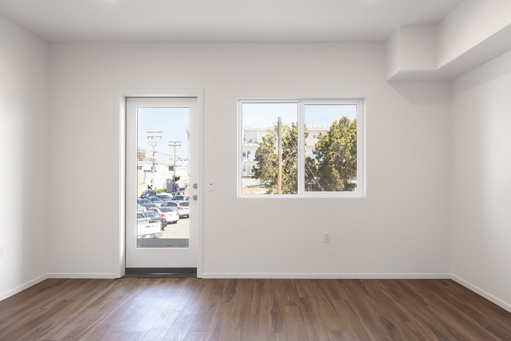 A room with a door and a window.