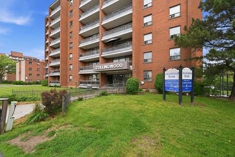 Collingwood apartment building with a sign in front.