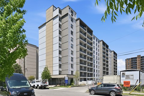 A large building with a parking lot in front of it.