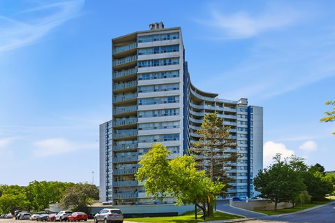A tall building with a blue sky in the background.