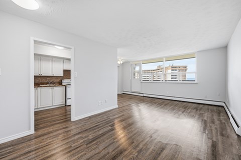 A room with wooden floors and white walls.