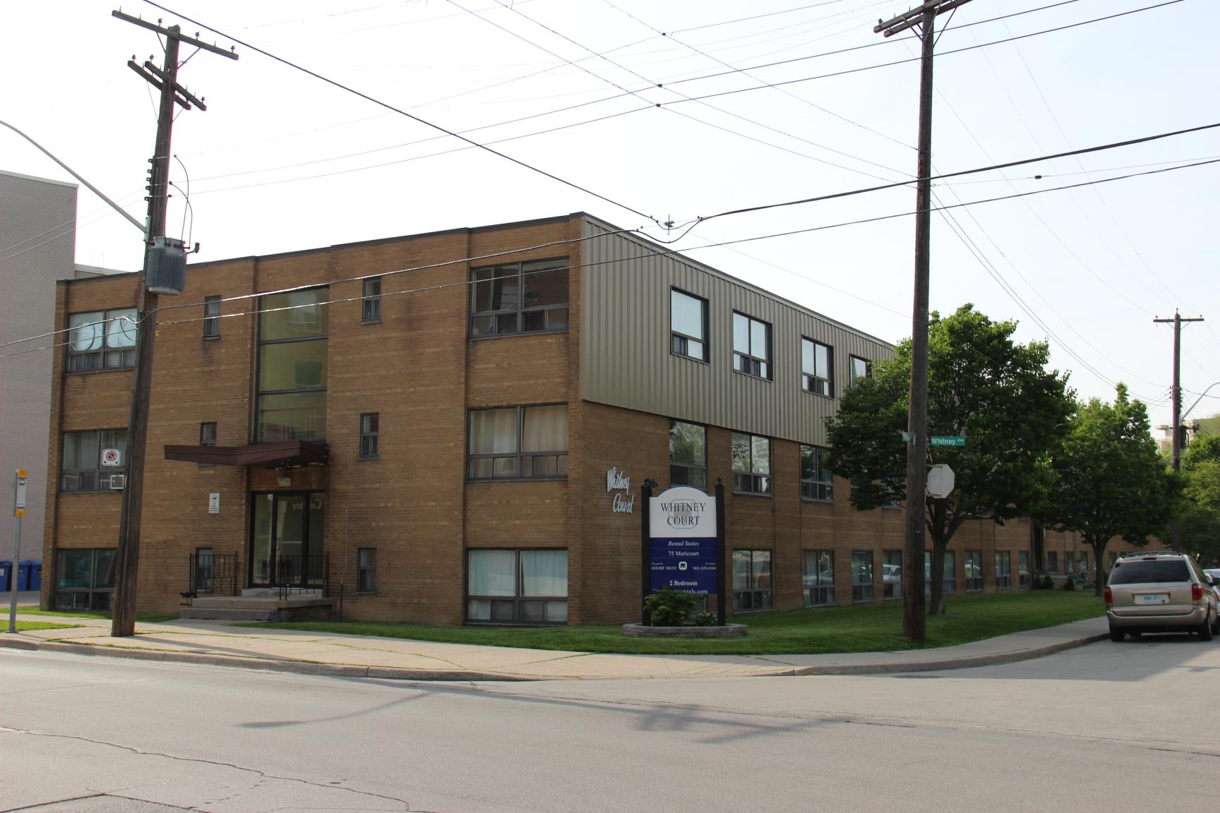 A building with a sign that says "Habitat for Humanity" on it.