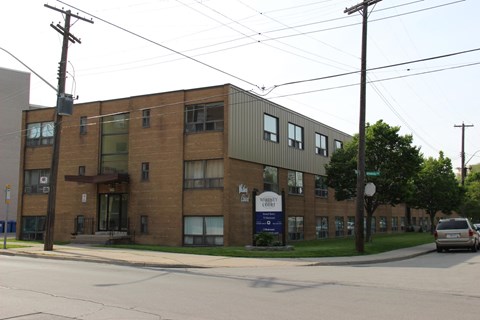 A building with a sign that says "Habitat for Humanity" on it.
