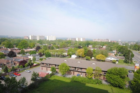 A residential area with houses and apartment buildings.