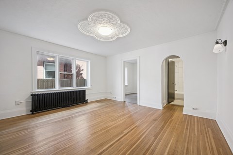 A room with wooden floors and white walls.