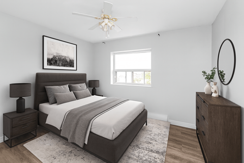 A bedroom with a large bed, a nightstand, and a dresser.
