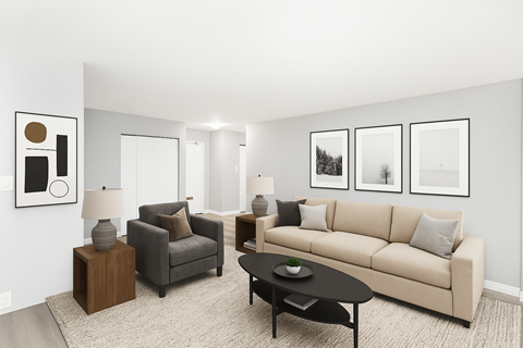 A living room with a couch, armchair, and coffee table.