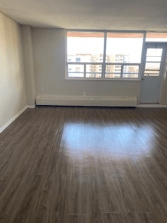 A room with a window and a door.