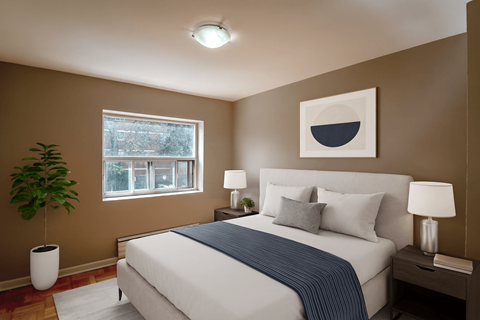 A bedroom with a large bed and a painting on the wall.